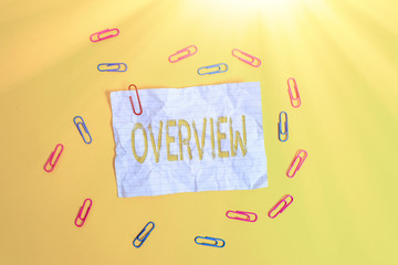 Poster - Handwriting text Overview. Conceptual photo the general review or summary of subject project movie book Blank crushed paper sheet message clips binders plain colored background