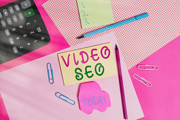 Wall Mural - Conceptual hand writing showing Video Seo. Concept meaning the process of improving the ranking or visibility of a video writing equipments and plain note paper placed on the table