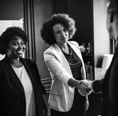 Poster - Business person greeted by a handshake