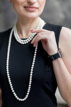 Business Woman Wearing Pearl Necklace