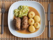 © petroos - Silesian dumplings with pork roulade and cabbage in roast sauce