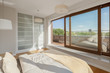 Elegant bedroom with window wall