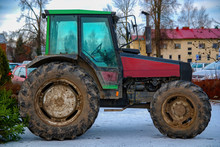 A Dirty Tractor In A Town Scene