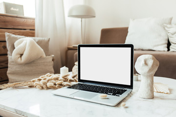 Wall Mural - blank screen laptop on marble table. copy space mockup template. interior design composition. work a