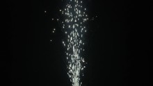 Slow Motion Shot Of Fireworks Producing An Upward Shower Of Sparks Against A Black Background. Commonly Known As A Gerb, This Pyrotechnic Is Also Called A Sparkling Fountain Or Waterfall.
