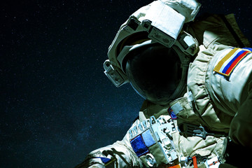 Poster - Space man in open space against the background of stars. Astronaut travels in space