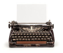 Old Vintage Typewriter And A Blank Sheet Of Paper Inserted. Isolated On White Background.
