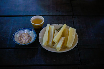 Wall Mural - Cu chi tunel. Eaten in the waters during the war. Sugar cane extract and peanuts.