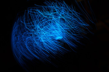 Wall Mural - blue abstract particles and lines with bokeh and blur in dark background