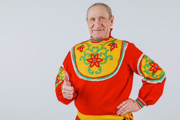 An elderly man in Slavic clothing on a white background