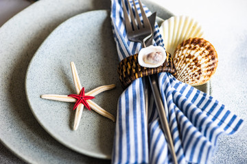 Marine table setting with sea stars and shells