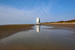 Lighthouse on Burnam-on-Sea Beach at low tide	