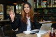 © Ranta Images - Happy young beautiful Asian businesswoman at the coffee shop