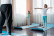 © velirina - Home workout in flat.Dad teaching little girls fitness, daughters. Physical morning exercises on blue yoga mats.Family children fun.Healthy indoor activity.Quarantine,coronavirus covid-19.No equipment