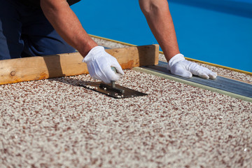 Laying the floor around the outdoor pool.