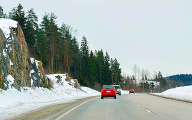 Wall Mural - Cars in road in winter Rovaniemi reflex