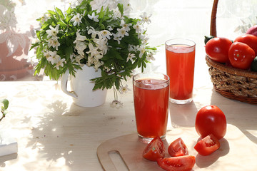 Tomato juice, drink and ingredients on a sunny table. The concept of detox diet and weight loss, healthy and natural food. Summer drinks, vitamins C, selective focus