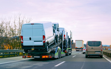 Wall Mural - Minivan carrier transporter truck in road Auto vehicles reflex