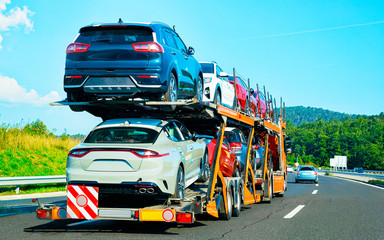 Wall Mural - Cars carrier truck on asphalt highway in Poland reflex