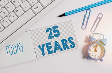 Wall Mural - Writing note showing 25 Years. Business concept for Remembering or honoring special day for being 25 years in existence White pc keyboard with paper and paper clip above white background