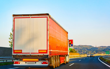 Canvas Print - Red Truck in alphalt road of Poland reflex