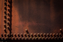 Background Of Steel And Rivets, Heavily Rusted With Long Shadows, Copy Space, Horizontal Aspect