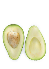 two halves of avocado on a white background