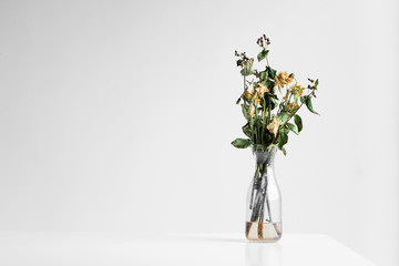 Wall Mural - Bouquet of wilted flowers on a white background