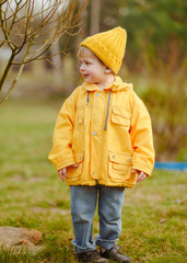 portrait of little model boy in nature