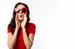Portrait excited beautiful woman wearing retro red sunglasses. Surprised young female look telling something. She get happy, announce that product on sale, discount in summer time. isolated on white