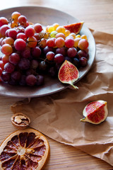 Wall Mural - Figs, grapes healthy vegetarian lunch