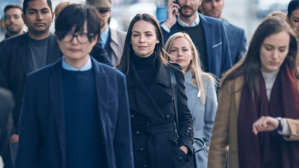 Diverse and Multicultural Office Managers and Business People Commute to Work in the Morning or from Office on Foot. Pedestrians are Dressed Smartly. People Walking in Downtown.