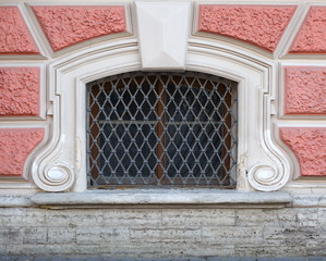 Wall Mural - A basement window with a metal barrier