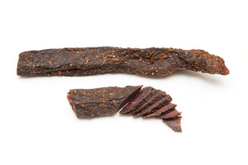 Wall Mural - Beef Biltong, South African Beef Jerky isolated on a white studio background.