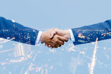 Multi exposure of businessman handshake for agreement partnership  after business deal sucess, commercial property investment together,collaboration and achievement concept.