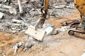 Wall Mural - Modern excavator at night parses debris with hydraulic pliers