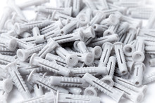 Lot Of Plastic Dowels On A White Background