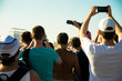 © Сергей Конторин - a group of people take pictures on phones