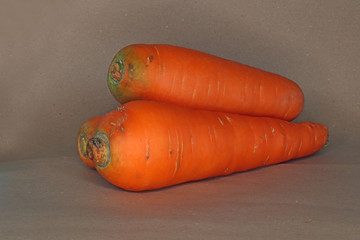 organic carrot on isolated brown background