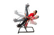 © tutye - Man doing exercise on inversion table for his back pain, isolated on white. Multiple positions.