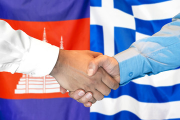 Handshake on Cambodia and Greece flag background. Support concept.