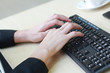 © cocorattanakorn - Close up on asian businessmen hands typing Keyboard with a cup of coffee on computer desk in office