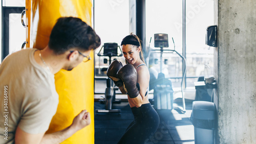 Принти на полотні Young attractive woman with instructor on kickboxing training