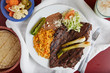 A classic Mexican dish of steak, rice and beans.
