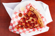 A classic triangle New York style slice of pepperoni pizza