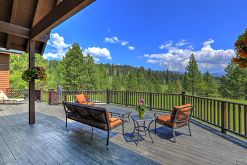 Amazing beautiful mountain home in Cascade Mountains in USA with green lavish nature and  cedar large home with back porch.