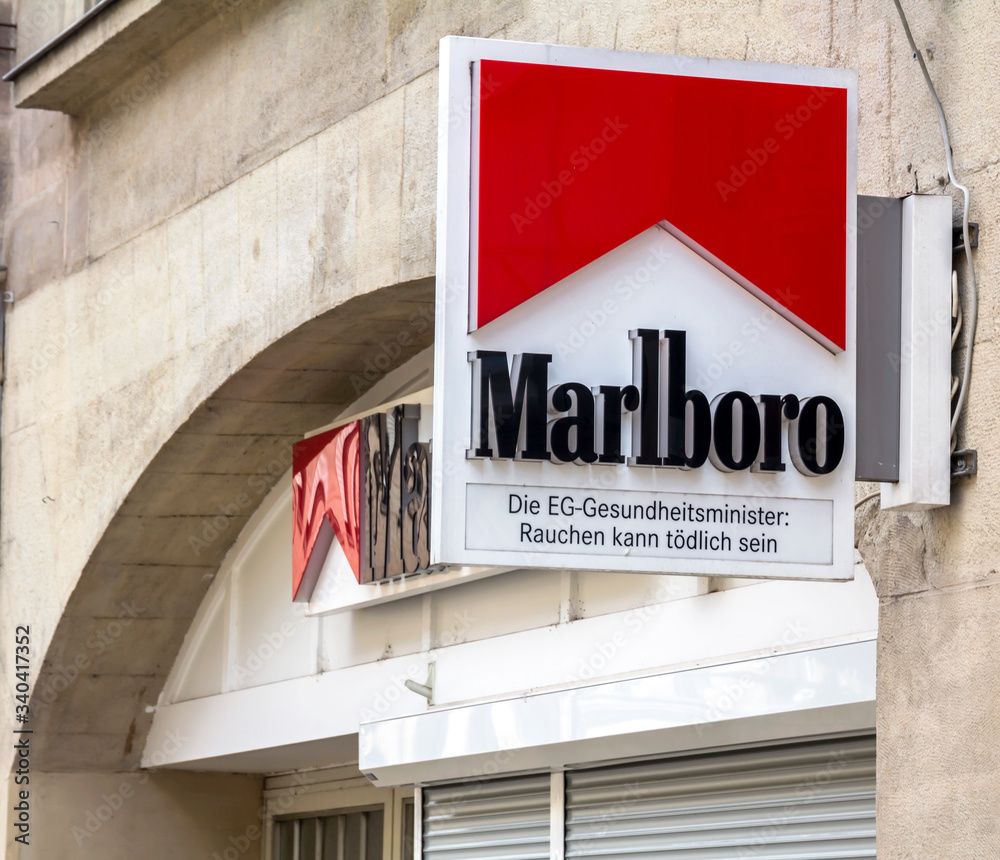 marlboro tobacco germany FURTH, Germany : Marlboro cigarette logo outside a shop. Marlboro is the  best-selling brand of cigarettes in the world. It is made by Philip Morris  Stock Photo