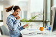 © Drazen - Carefree businesswoman singing while listening music in the office.