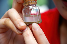A Little Bottle With Panned Off Sand And Dirt And Gold