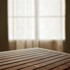 desk of free space and blurred window in home 